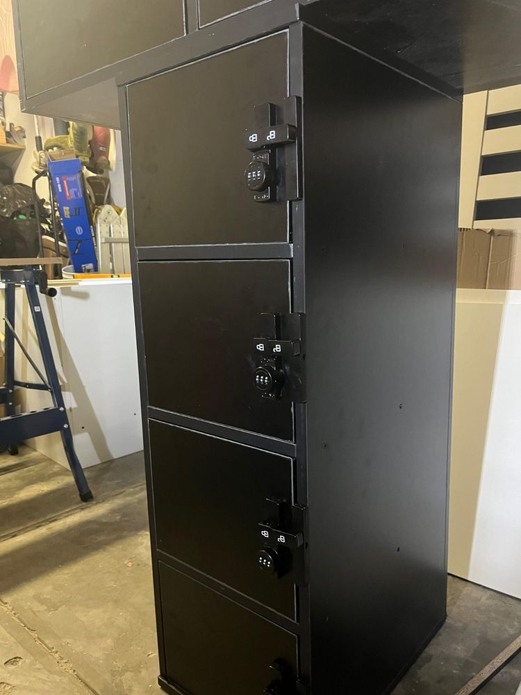 The KIXLAB locker bank, four doors high with a combination lock on each