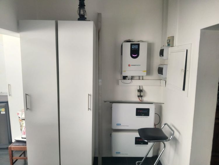 A pantry, an inverter bay and tall cupboards: Before